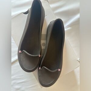 CROCS Women’s Slip-On Flats with Pink Button Accents
